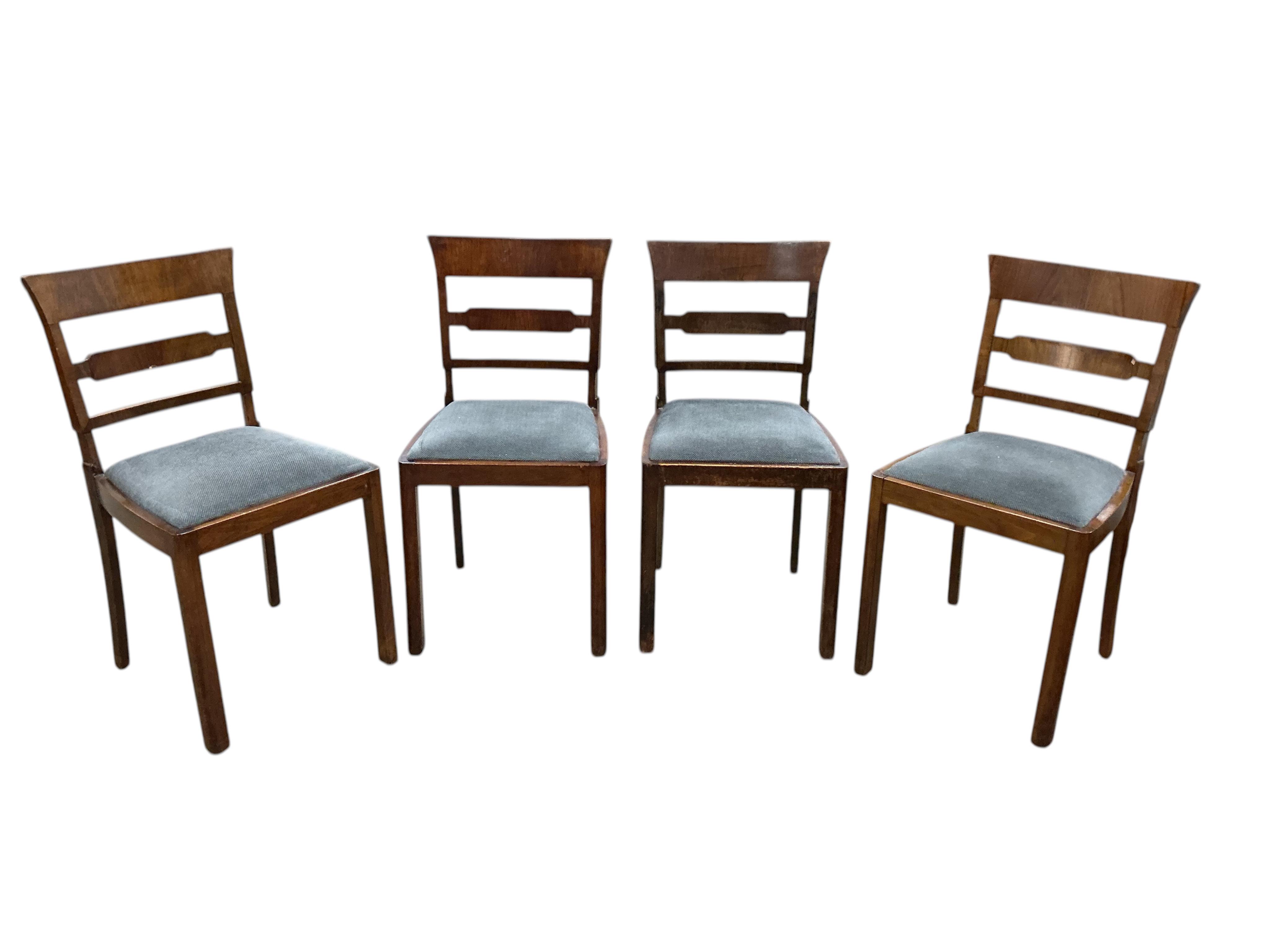 An Art Deco style beech and birds eye maple extending dining table, width 110cm, depth 84cm, height 75cm, and six similar chairs, two with arms